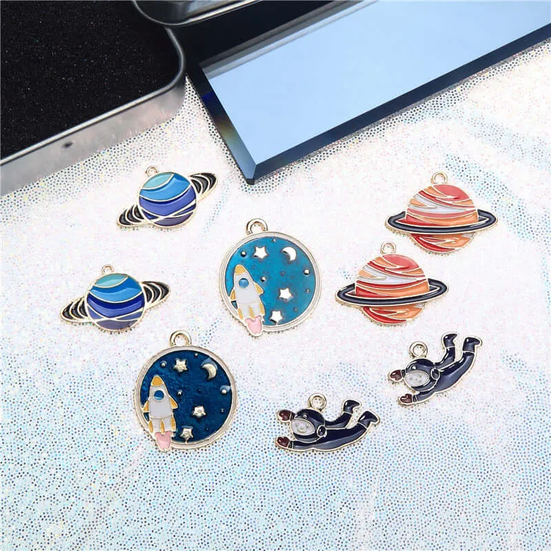 Factory direct alloy jewelry accessories rocket astronaut planet exquisite DIY earrings ear clip pendant material package